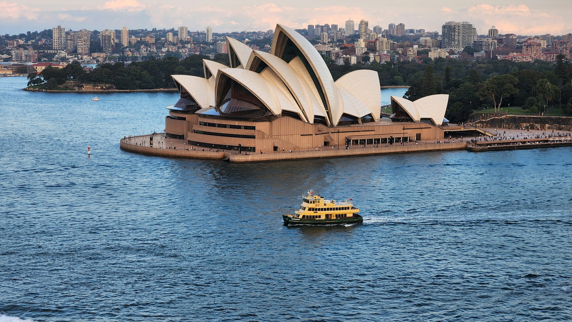 Sydney Opera House and harbour with a ferry passing