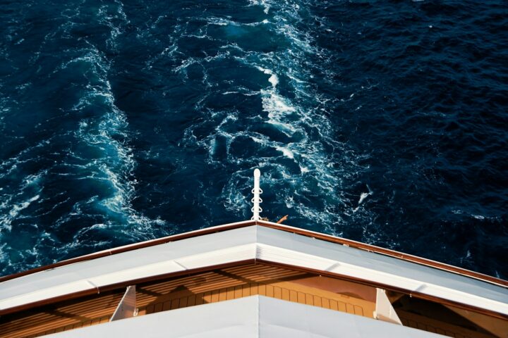 Bow of a ship cutting through deep blue Atlantic water