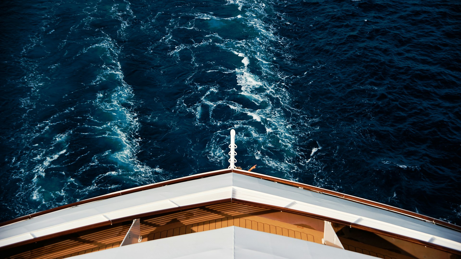Bow of a ship cutting through deep blue Atlantic water