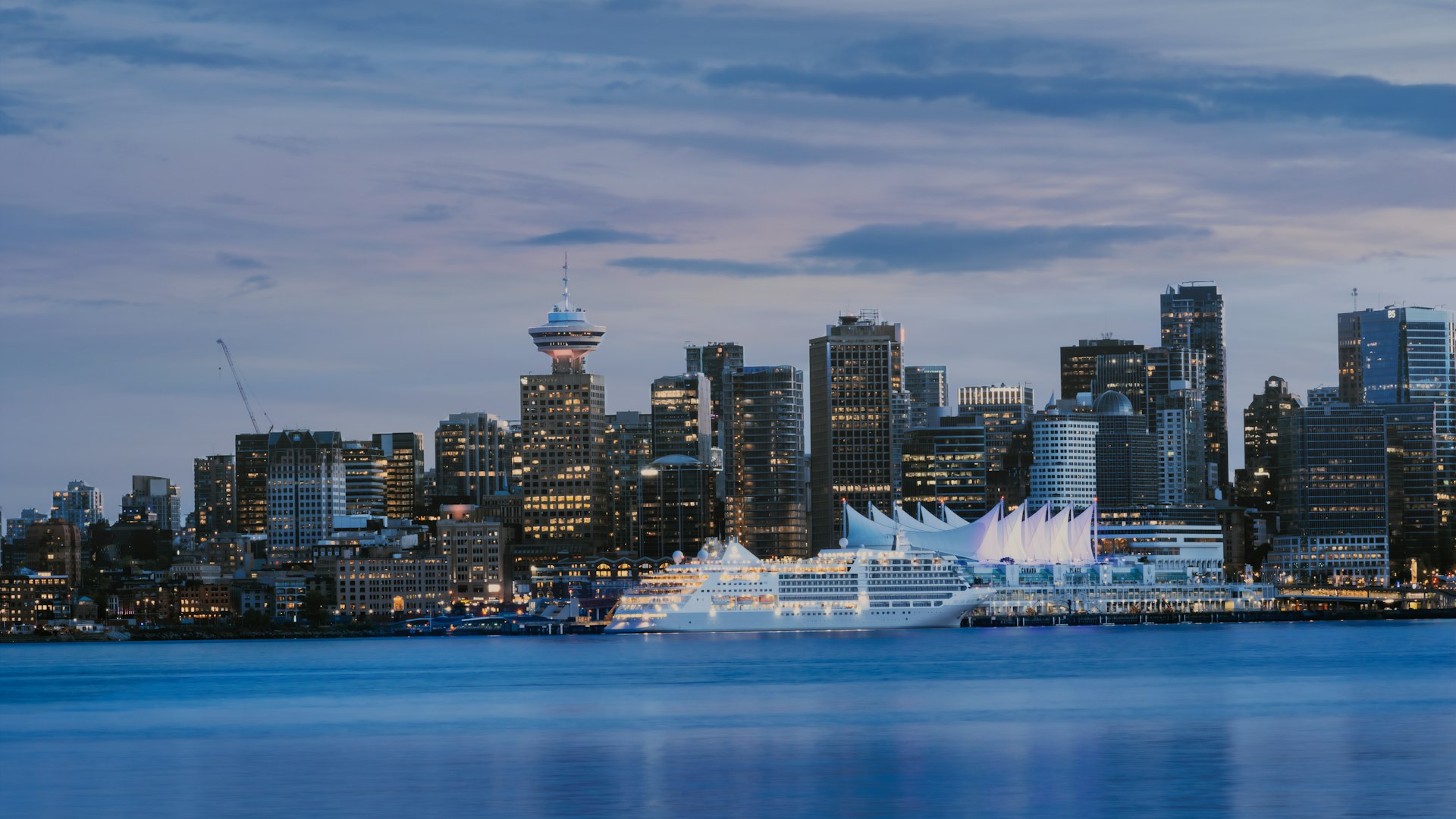 Vancouver skyline and Canada Place cruise terminal at dusk