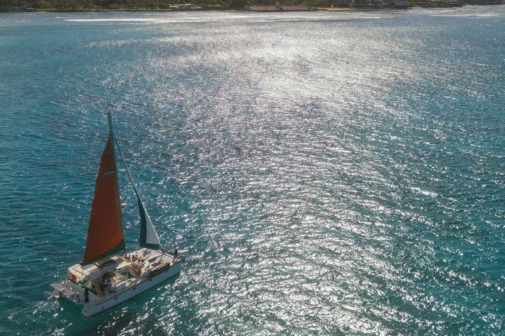Catamaran sailing off Waikiki with Diamond Head in the background