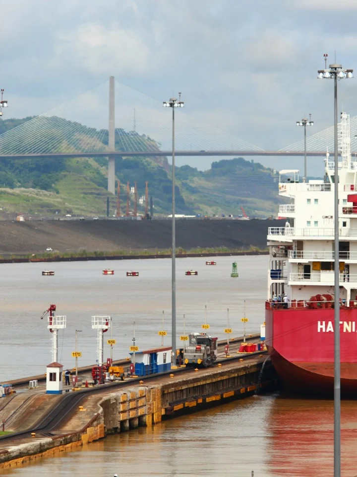 Ship inside a lock chamber of the Panama Canal with the Centennial Bridge behind