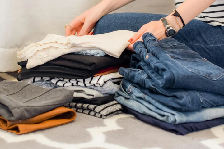 Folded clothes being sorted for packing