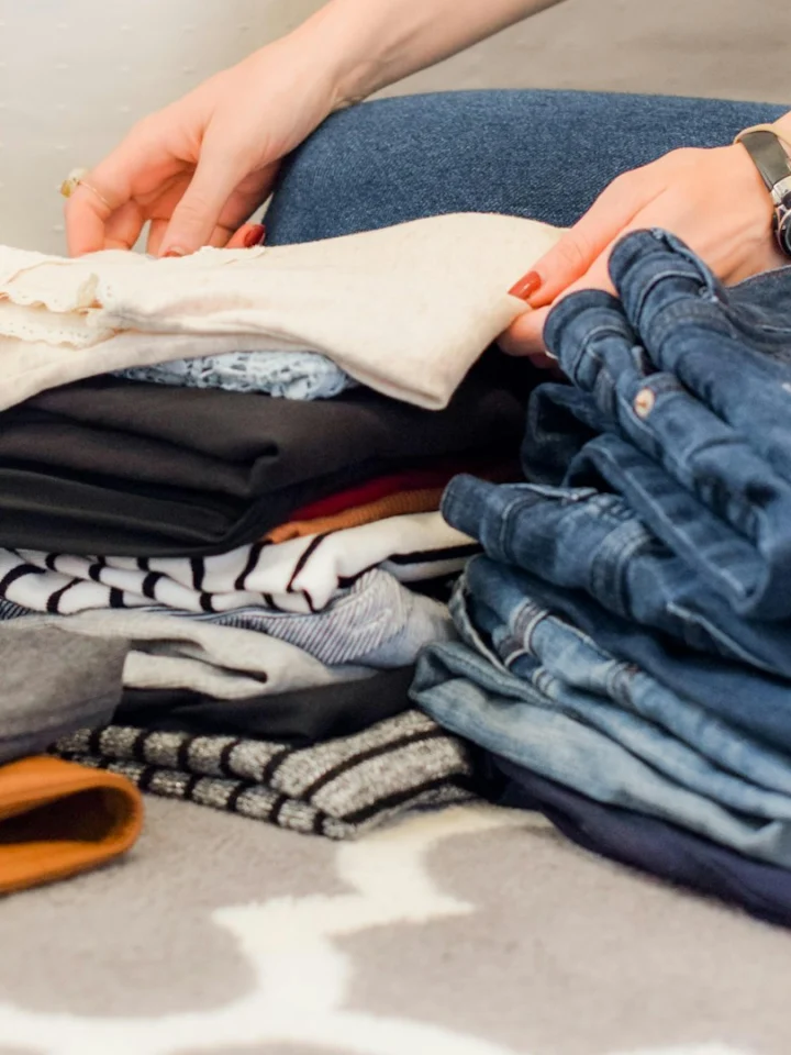Folded clothes being sorted for packing